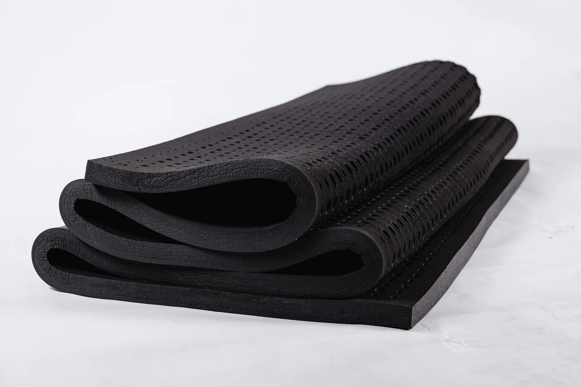 Folded graphite-infused latex sheet showing its flexibility